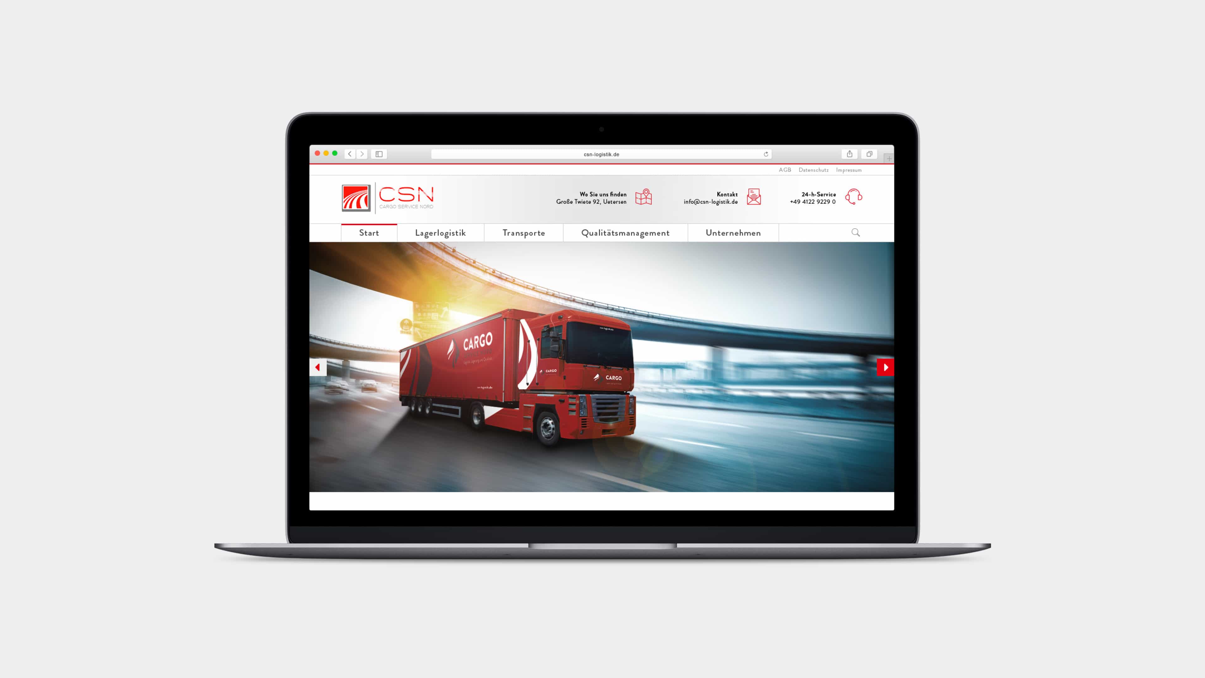 Laptop zeigt roten LKW auf der Startseite von Cargo Service Nord 