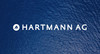 Logo der Hartmann AG mit blauen Leder Hintergrund