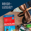 Reiseführer Deutschland und Reisetasche und Text 