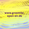 URL www.groemitz-open-air.de vor gelb-buntem Hintergrund