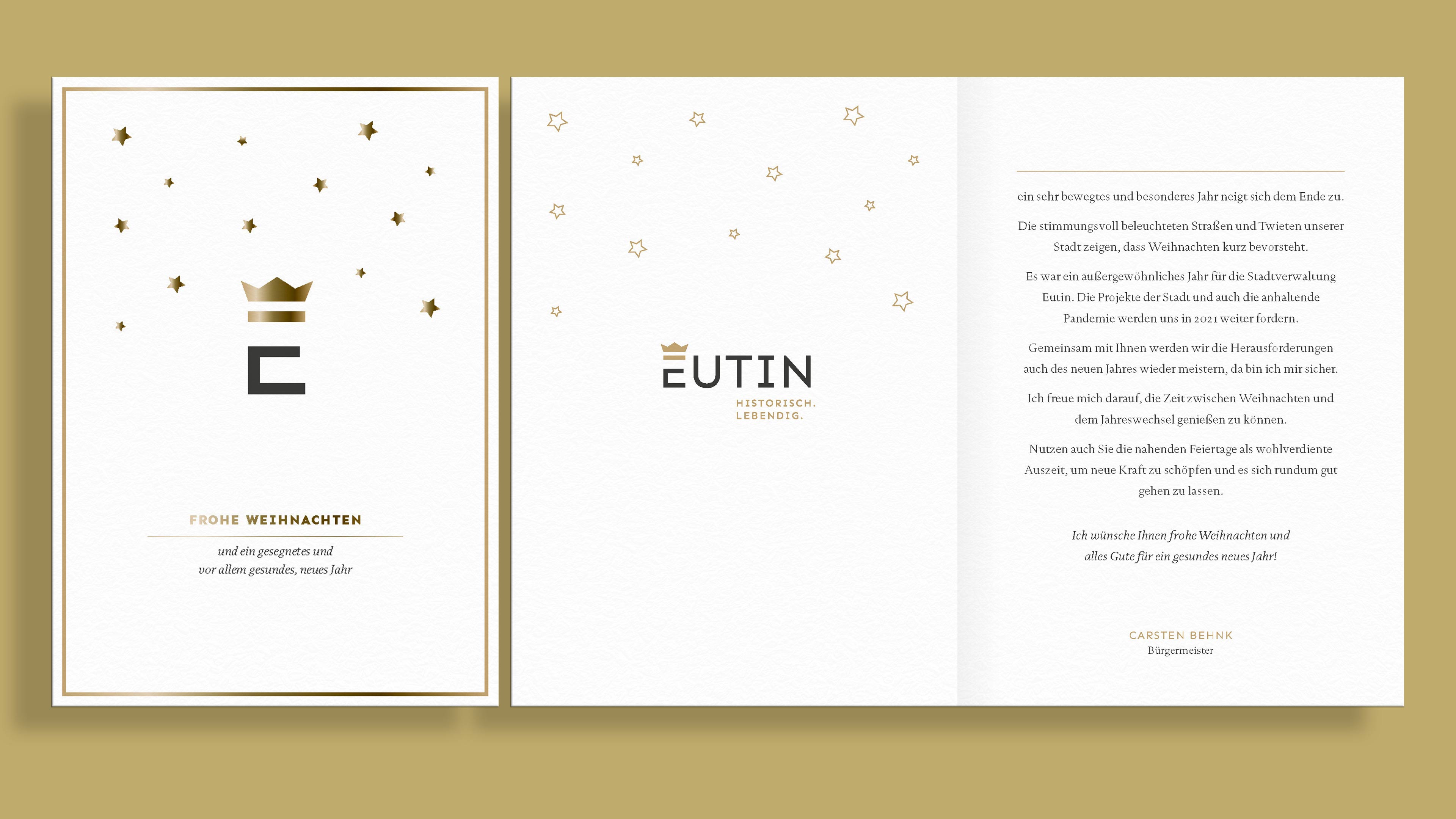 Titel- und Innenseite einer weißen Weihnachtskarte der Eutin GmbH