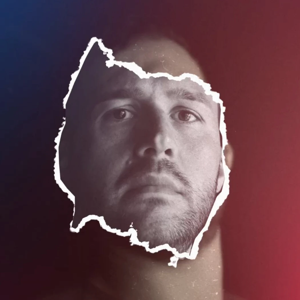 h2_sg_einlauftrailer_teaser_08.jpg Ausschnitt der Gesichtspartie des Spielers Burić auf blau-rotem Hintergrund