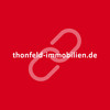 URL von Thonfeld Immobilien mit rotem Hintergrund