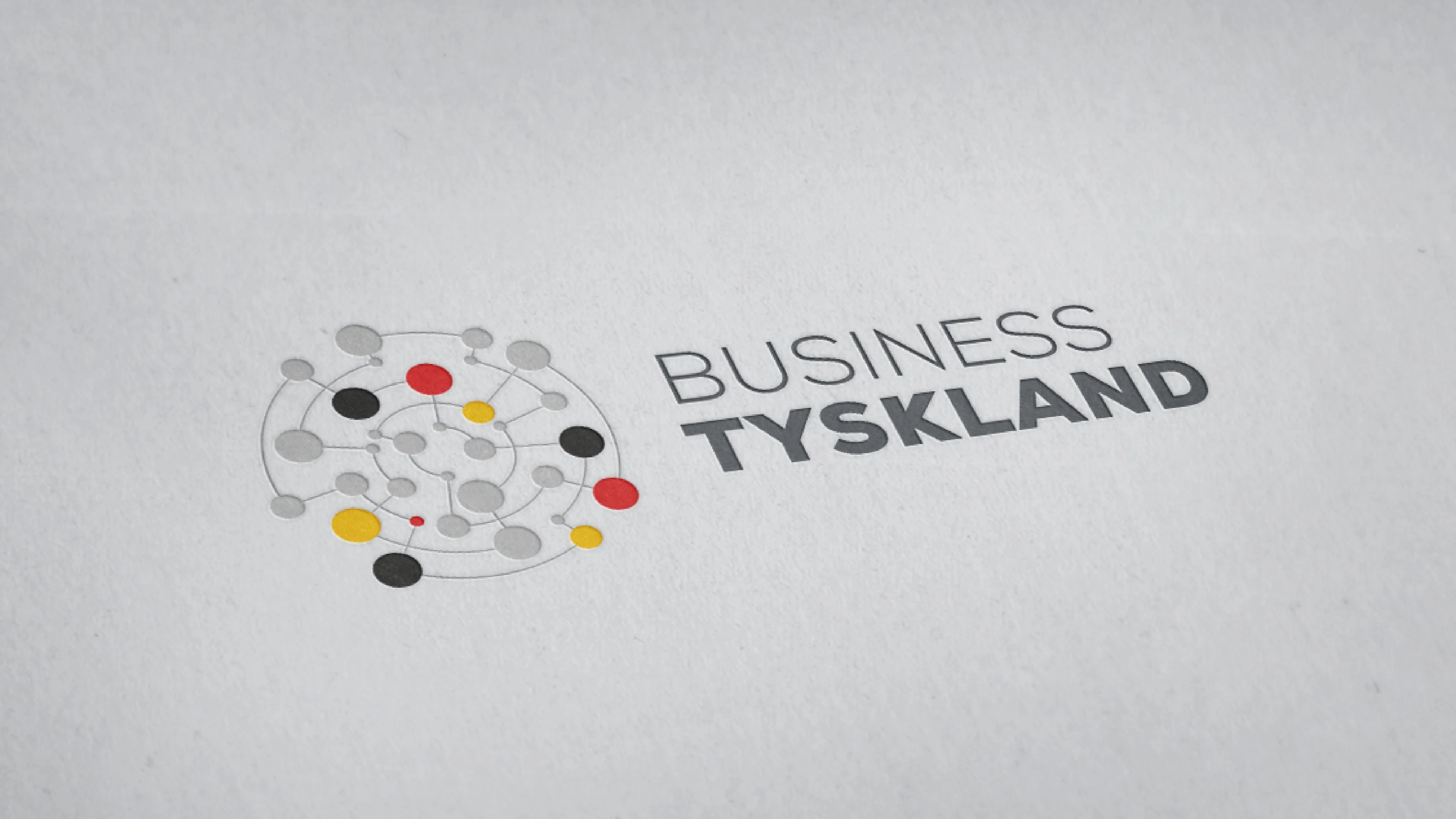 Logo und Schriftzug 'Business Tyskland' auf grauem Hintergrund