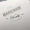 Logo von der Marienhof auf Papier gedruckt