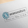Das Logo von Genüssküste eingestampft auf weißem Papier