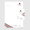 Briefpapier und Visitenkarte der Firma AxioDent mit rot-grauem Logo und Streifen