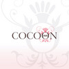 Logo für Cocoon Inn vor weiß-rosa Hintergrund