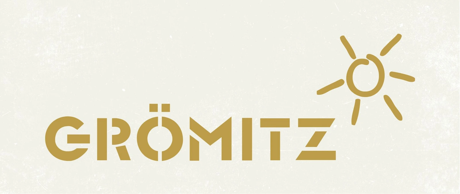 h2_tsg_teaser_01.jpg Beige Grafik mit dem Schriftzug Grömitz und einer gemalten Sonne